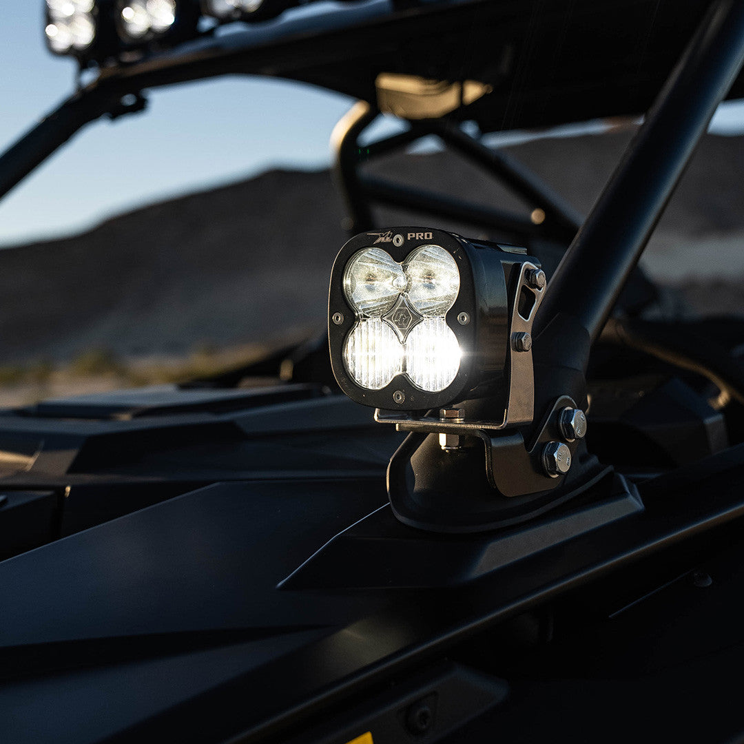Off-road vehicle with a mounted light bar against a mountainous landscape